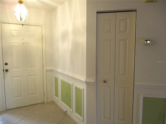 interior space with light tile patterned floors