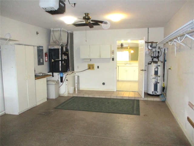 interior space with electric panel, heating unit, water heater, a garage door opener, and ceiling fan