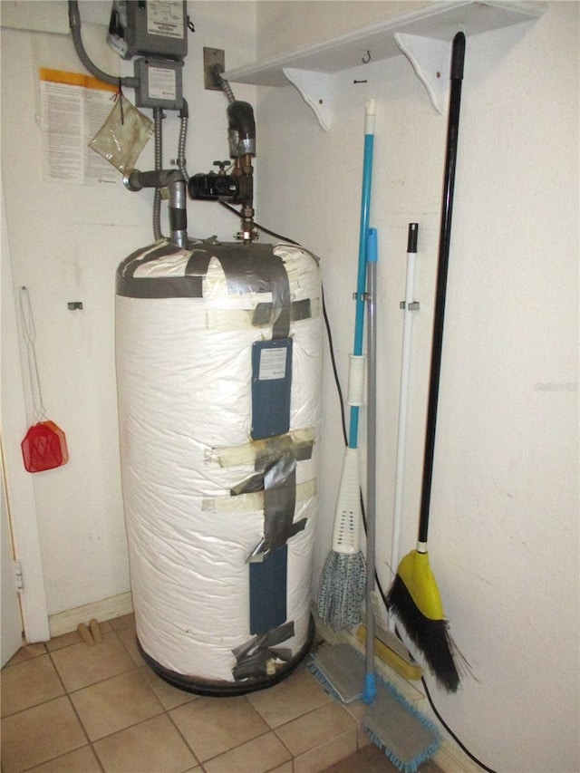 utility room featuring gas water heater