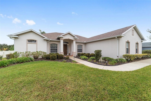 single story home with a front lawn