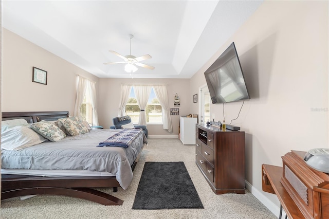 bedroom featuring light carpet and ceiling fan