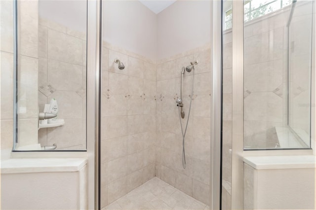 bathroom with tiled shower