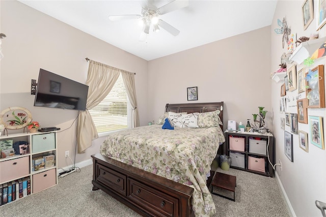 bedroom featuring light colored carpet and ceiling fan