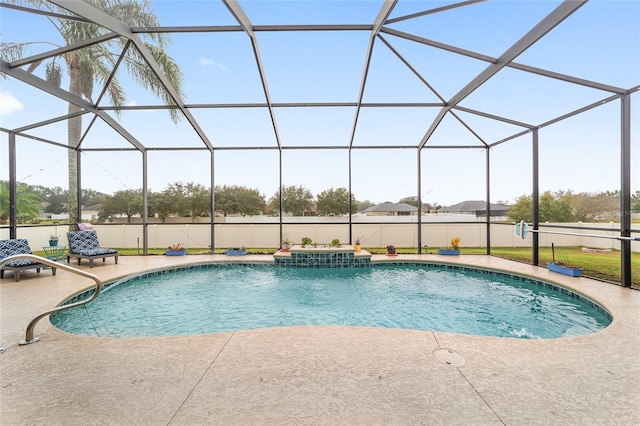 view of swimming pool featuring a patio area and a lanai