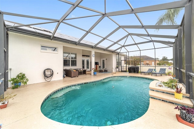 view of pool featuring a lanai and a patio area