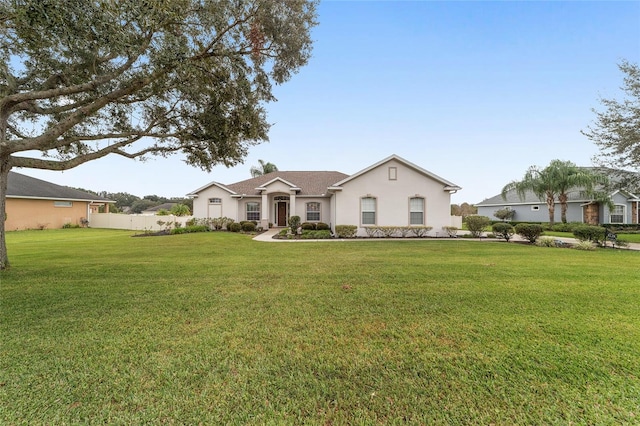 ranch-style home with a front yard