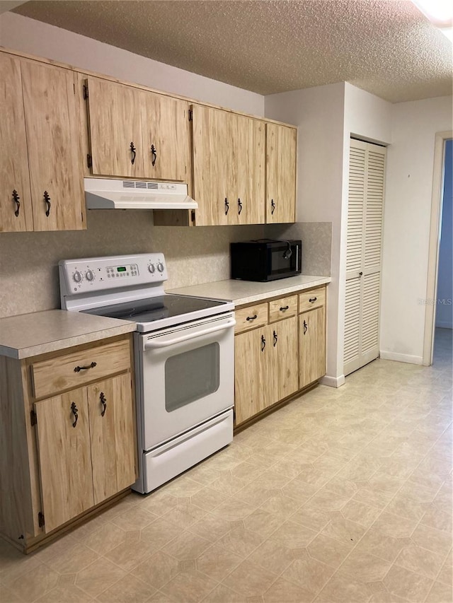 kitchen with light brown cabinetry, a textured ceiling, and white electric stove