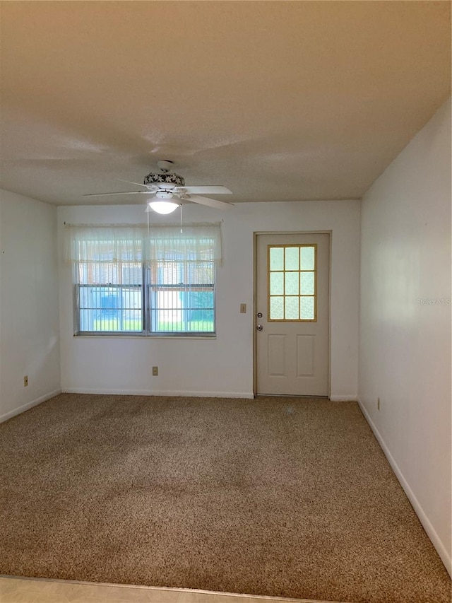 interior space with ceiling fan