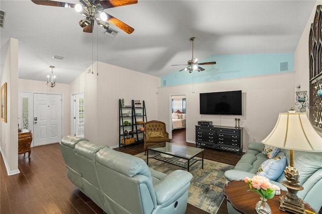 living room featuring dark hardwood / wood-style flooring, ceiling fan with notable chandelier, and lofted ceiling