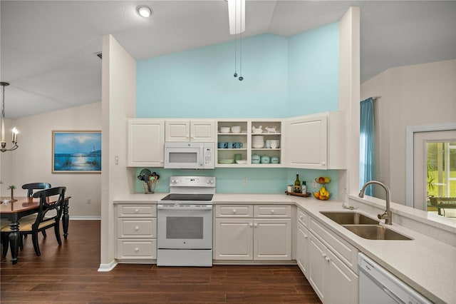 kitchen with sink, hanging light fixtures, white appliances, lofted ceiling, and white cabinets