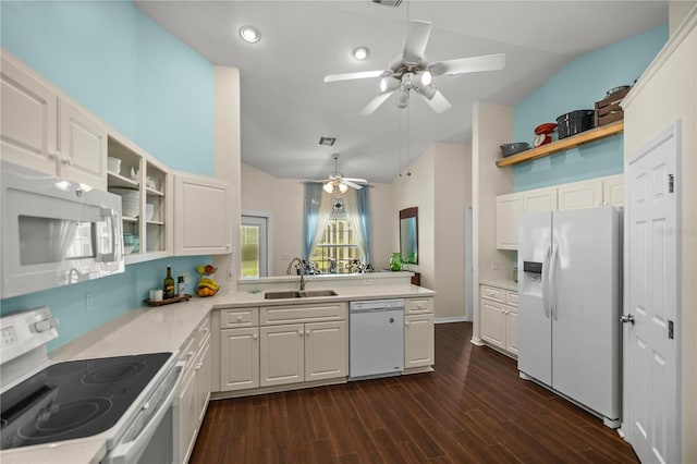 kitchen featuring dark hardwood / wood-style flooring, white appliances, sink, and white cabinets