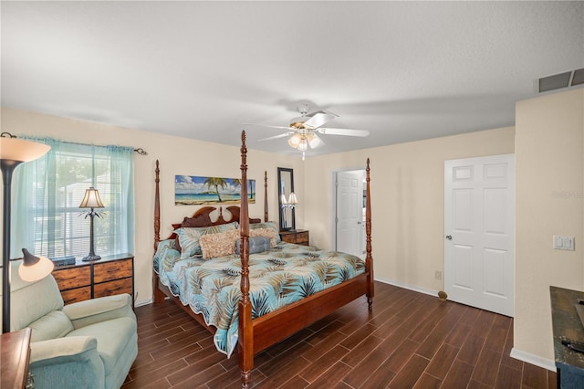 bedroom with ceiling fan and dark hardwood / wood-style floors