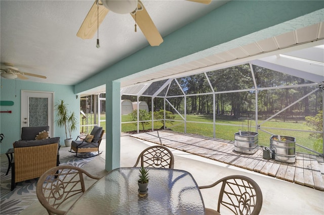 view of patio / terrace featuring a lanai and ceiling fan