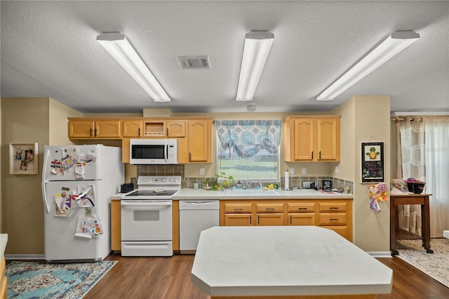 kitchen featuring dark wood-type flooring, white appliances, sink, and light brown cabinets