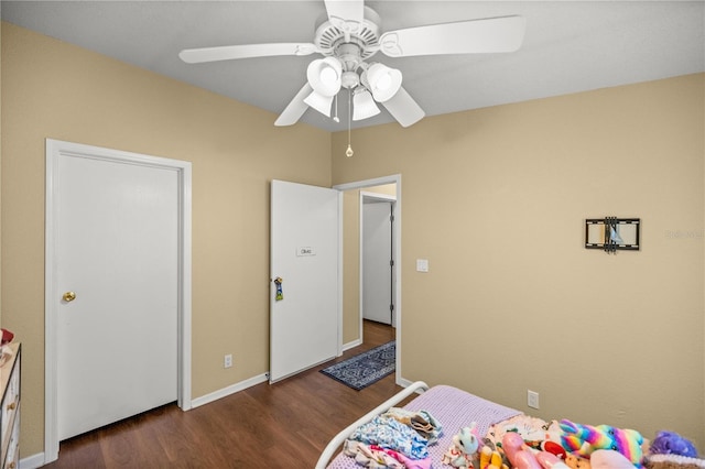 bedroom featuring ceiling fan and dark hardwood / wood-style floors