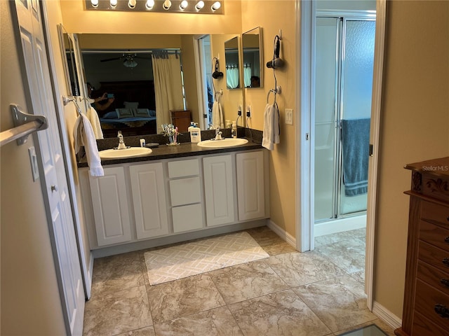 bathroom with walk in shower and vanity