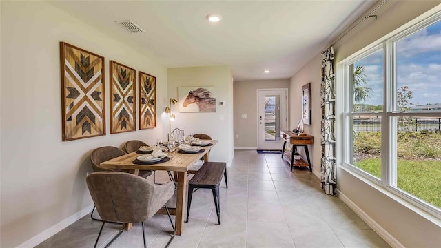 dining area with light tile patterned flooring