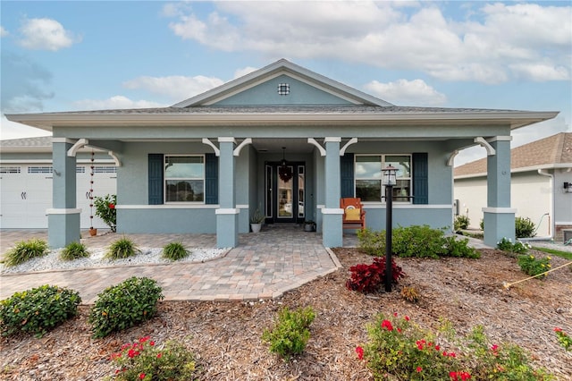 view of front of house with a garage and covered porch