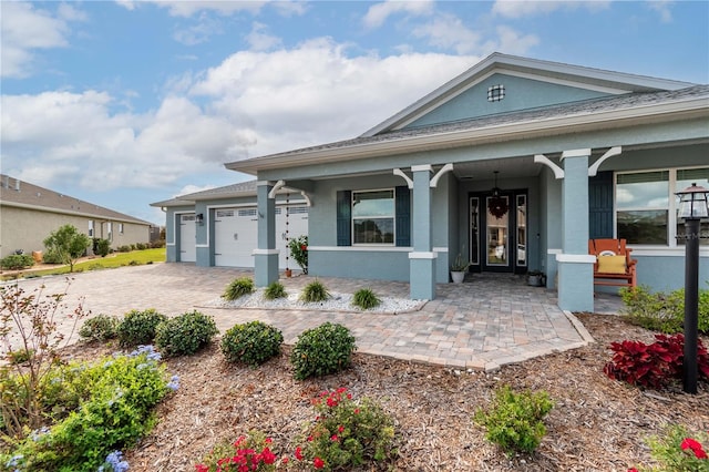 view of front of property with a garage and a porch