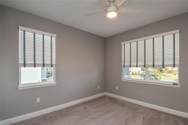 spare room featuring carpet flooring and ceiling fan