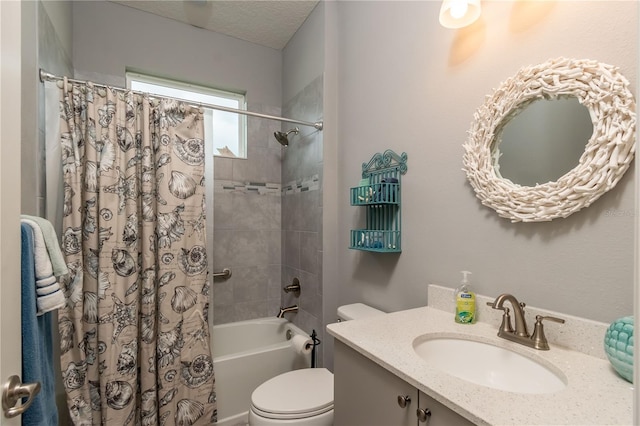 full bathroom with toilet, shower / bath combo, vanity, and a textured ceiling