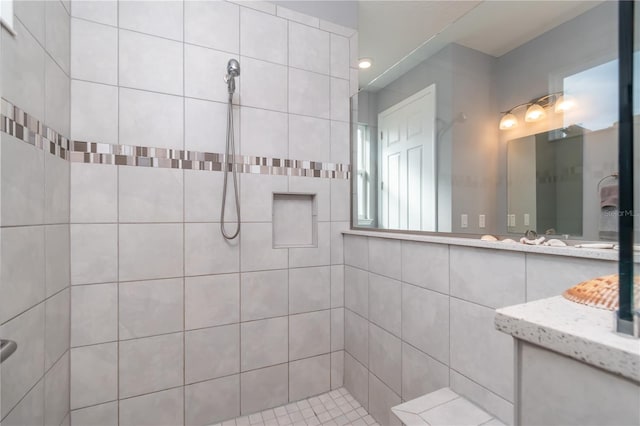 bathroom featuring a tile shower