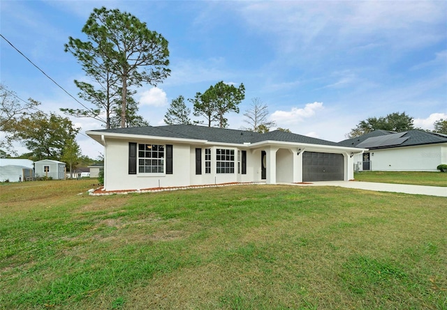 ranch-style home with a garage and a front yard