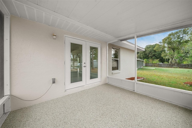 unfurnished sunroom featuring french doors