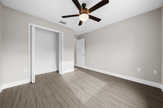 unfurnished bedroom featuring ceiling fan and light hardwood / wood-style flooring