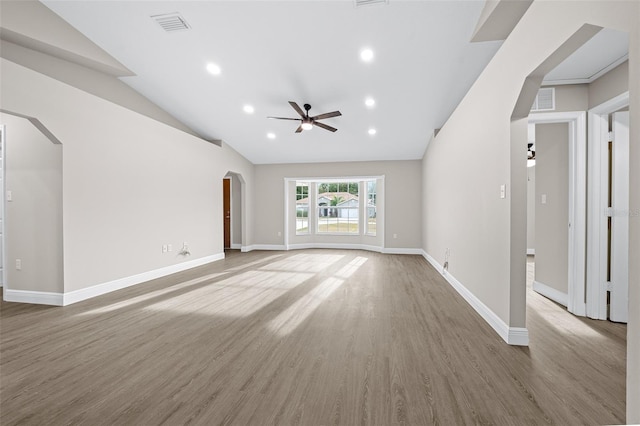 unfurnished living room featuring hardwood / wood-style flooring, ceiling fan, and lofted ceiling