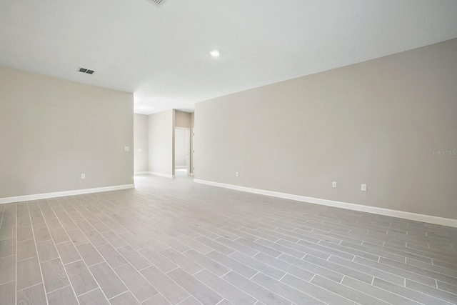 empty room with light hardwood / wood-style flooring