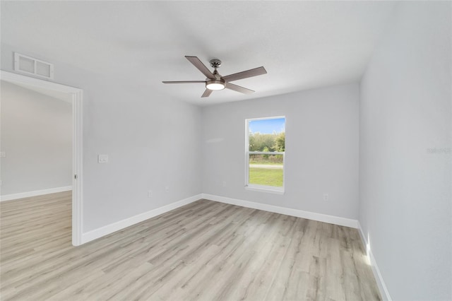 unfurnished room with baseboards, visible vents, ceiling fan, and light wood finished floors