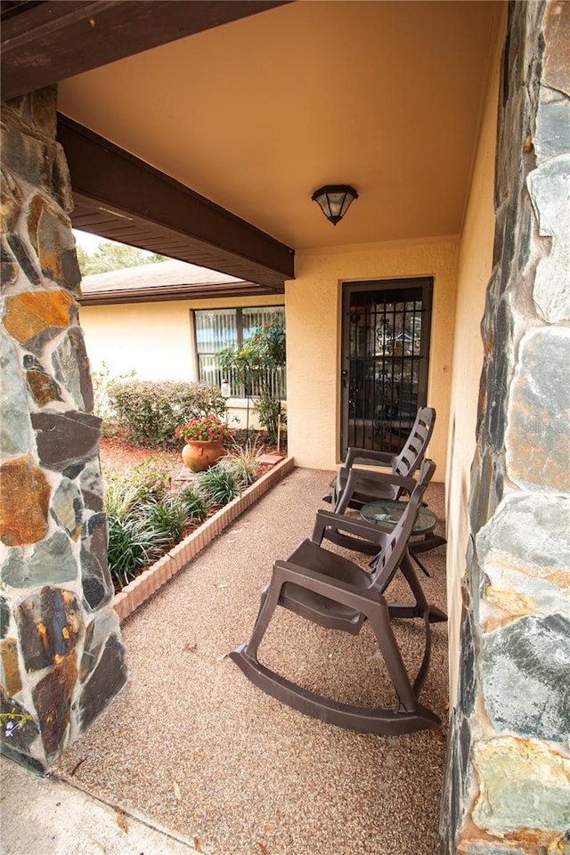 property entrance with a patio