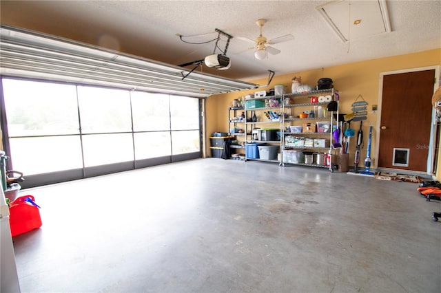 garage with a garage door opener and ceiling fan