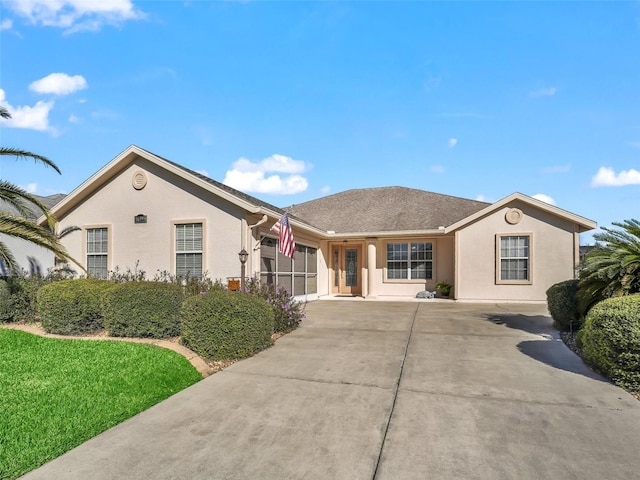 single story home featuring a front yard