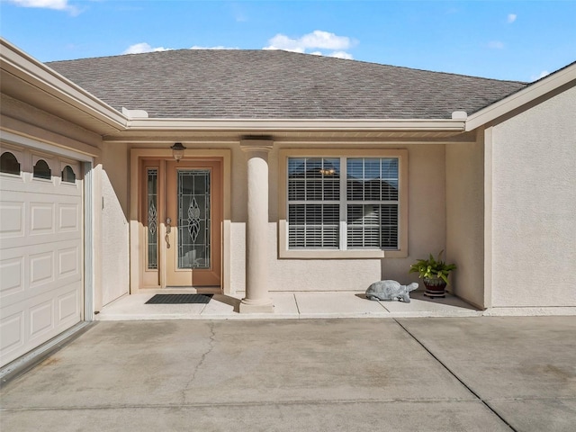 property entrance with a garage