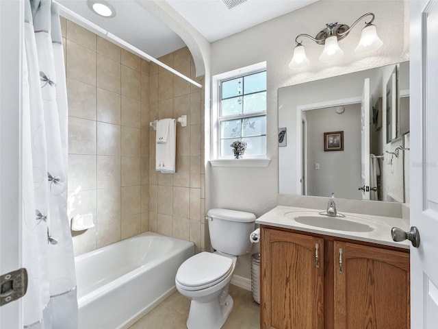 full bathroom featuring tile patterned floors, vanity, toilet, and shower / bathtub combination with curtain