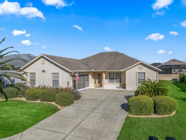 ranch-style house featuring a front lawn