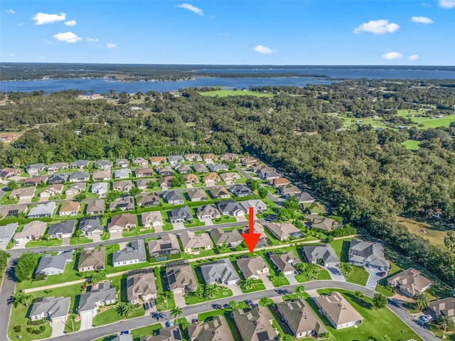 drone / aerial view with a water view