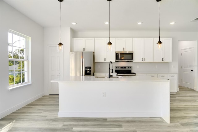 kitchen featuring hanging light fixtures and stainless steel appliances