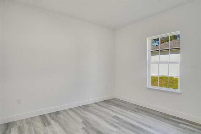 empty room with light hardwood / wood-style floors