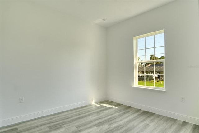 spare room with light wood-type flooring