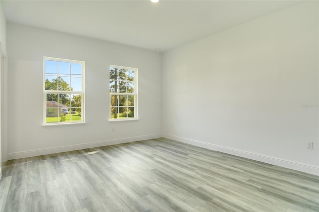 unfurnished room featuring light hardwood / wood-style flooring