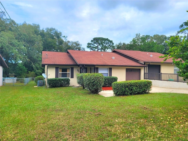 view of front of property with a front lawn and a garage