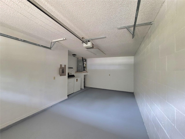 garage featuring electric panel and a garage door opener