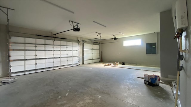 garage with electric panel and a garage door opener