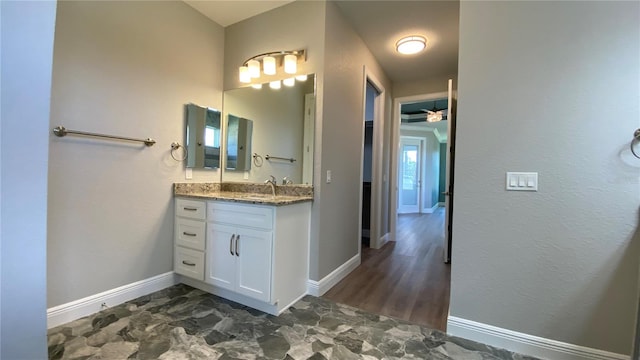 bathroom featuring vanity and baseboards