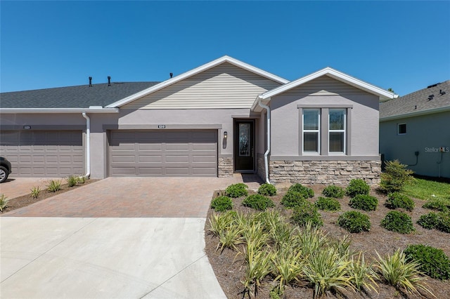 ranch-style home featuring a garage