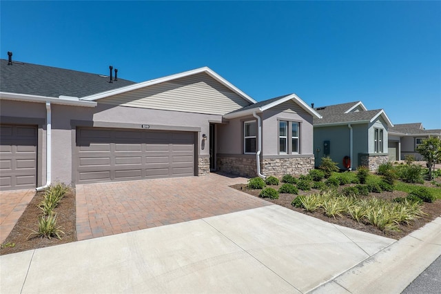 ranch-style home featuring a garage