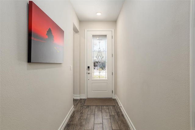 doorway to outside featuring hardwood / wood-style flooring